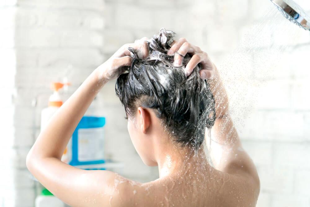 woman washing hair - beauty myths