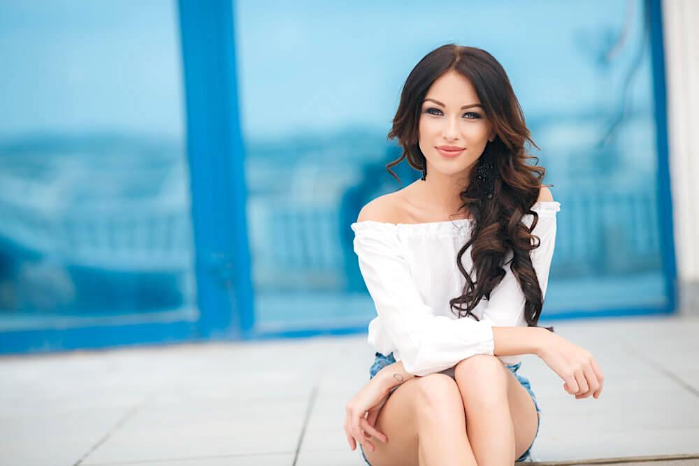 Beautiful woman with long brunette curls