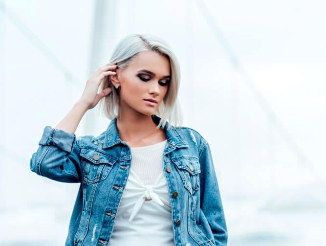 Young fashionable woman with short straight platinum bob