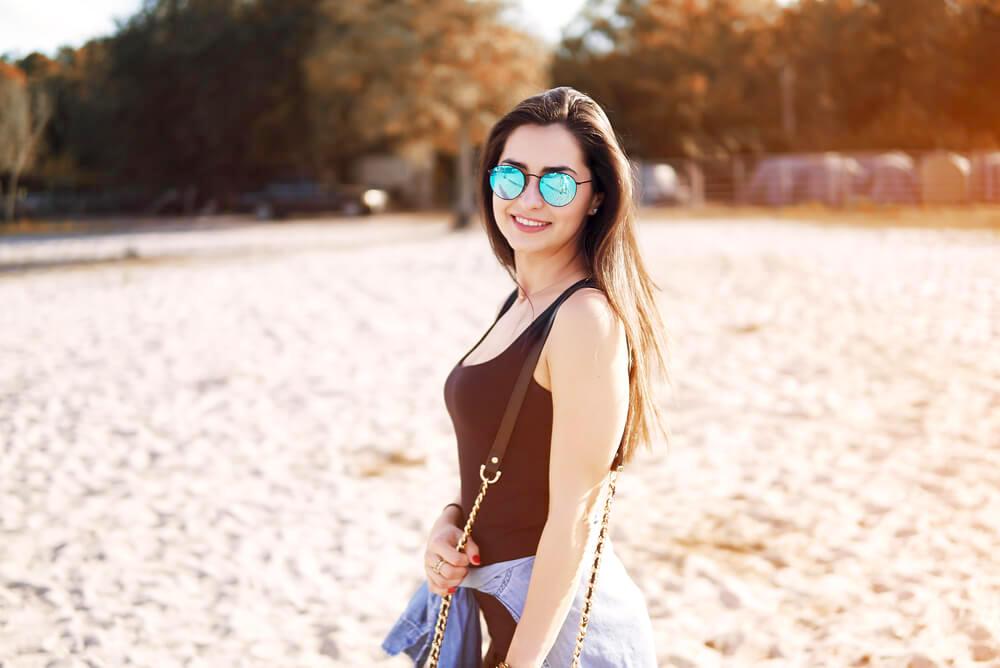 woman wearing sunglasses at the beach