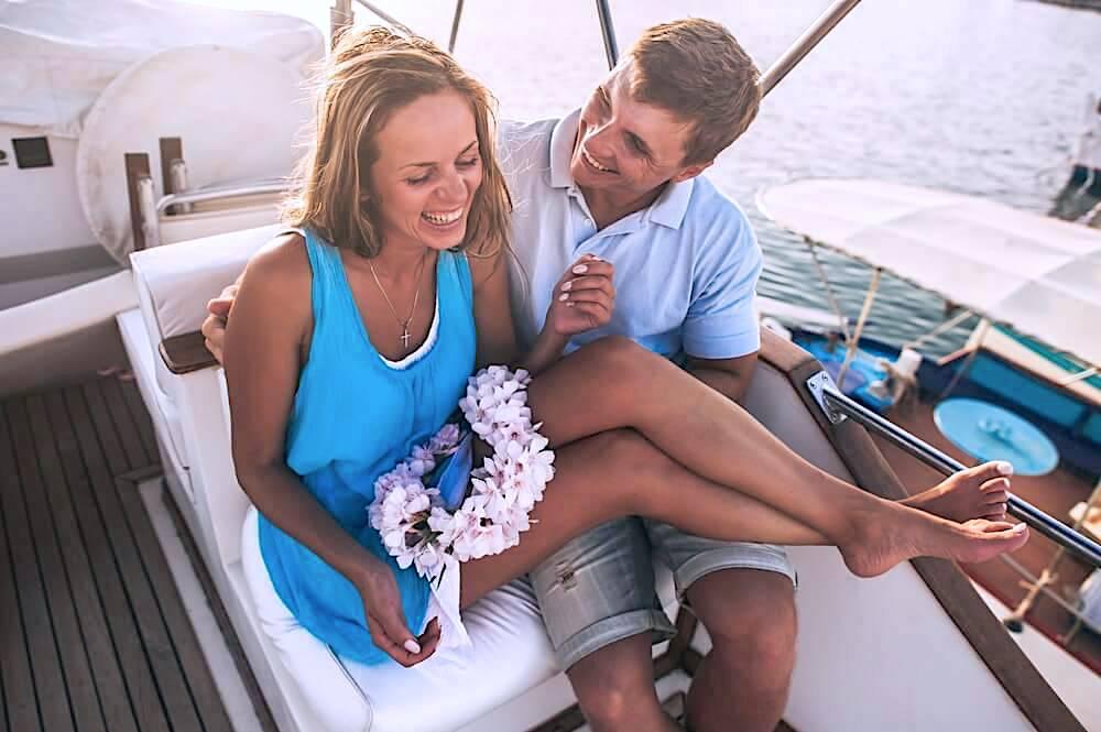 Happy couple laughing on a cruise ship