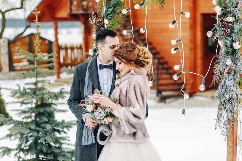 Happy young couple getting married, winter style