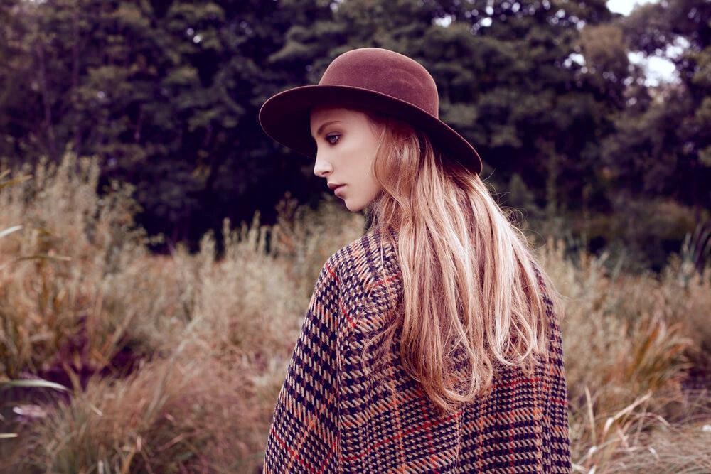 Fashionable woman in tweed coat and hat