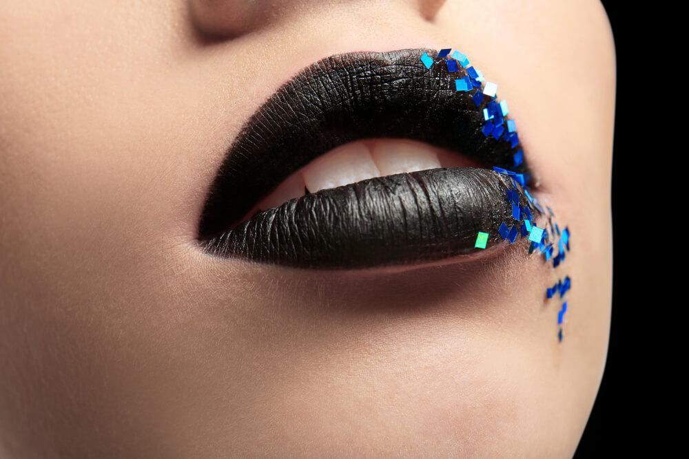 Black lipstick with blue sequins 