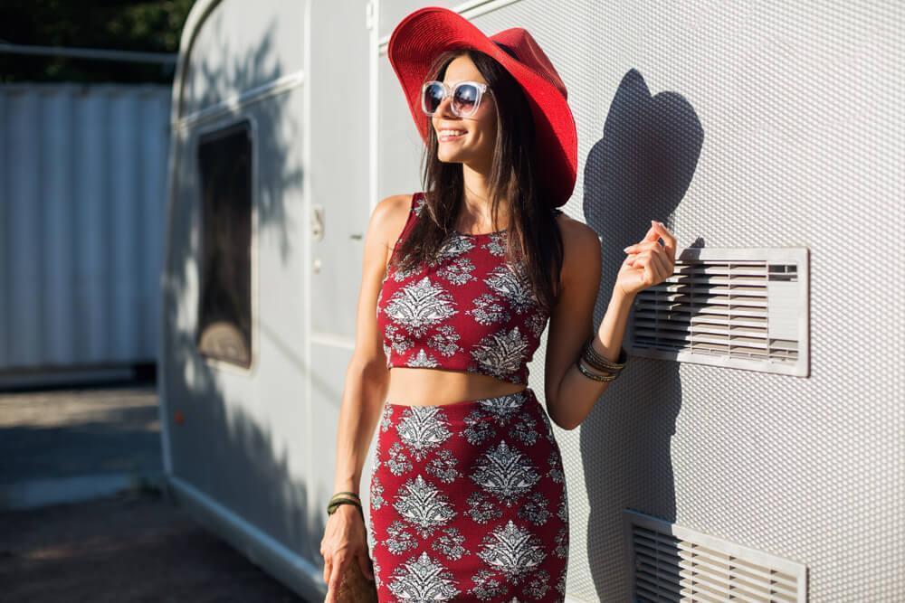 Fashionable woman in red dress and red hat
