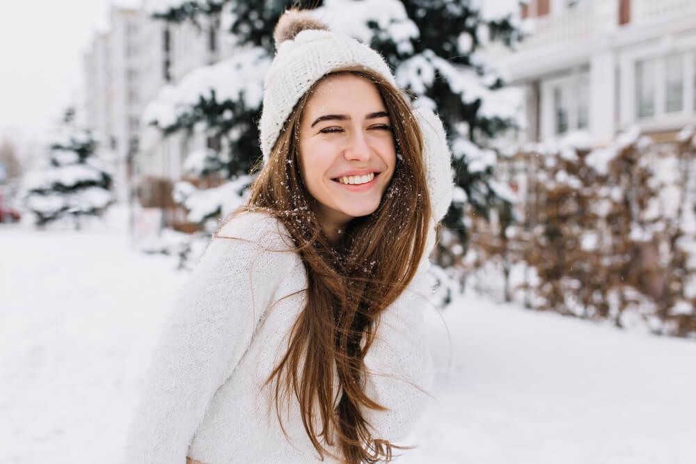 Woman with no makeup outdoors in snow