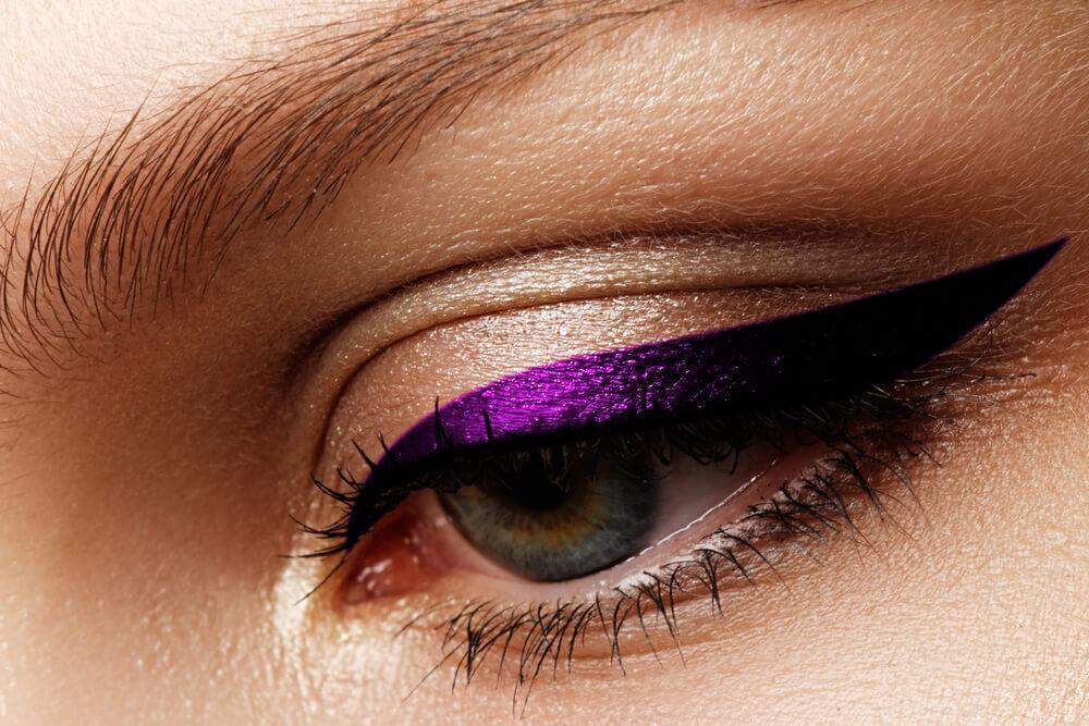 Close-up of purple winged eyeliner