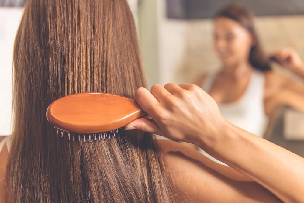 Woman brushing hair