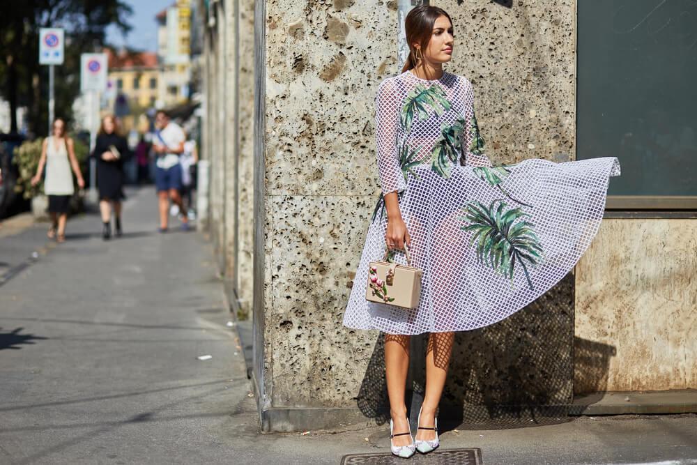 Woman in printed dress on street