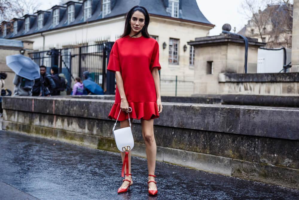 Woman in red dress on street
