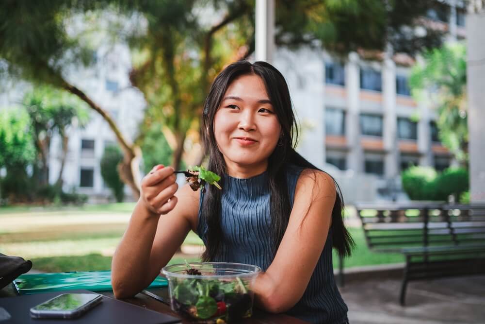 woman eating salad