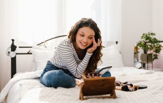 Woman applying makeup