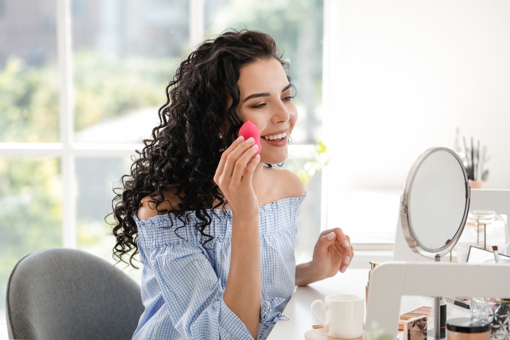 Woman applying makeup